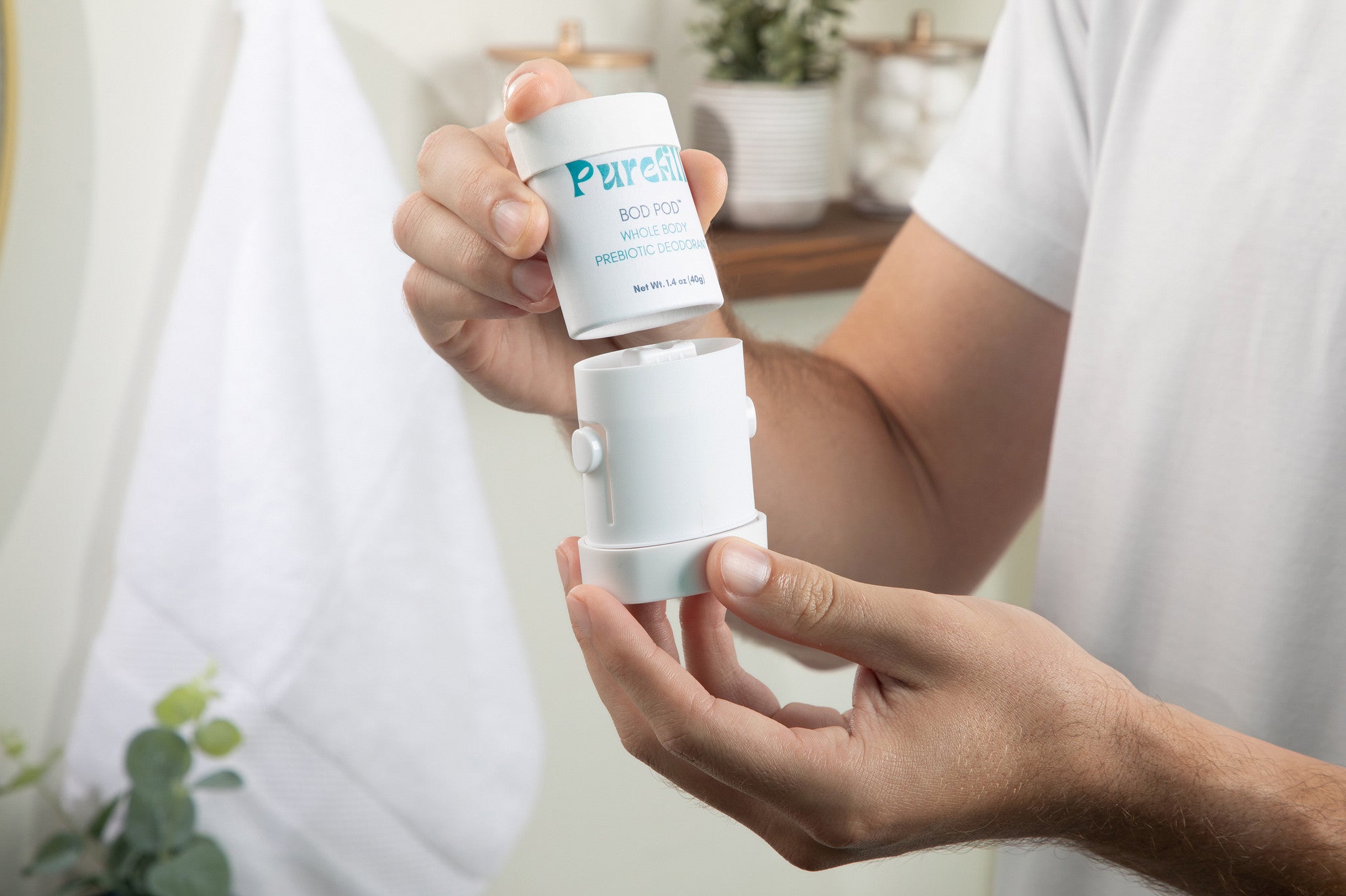 A man refilling a Purefill whole body deodorant case