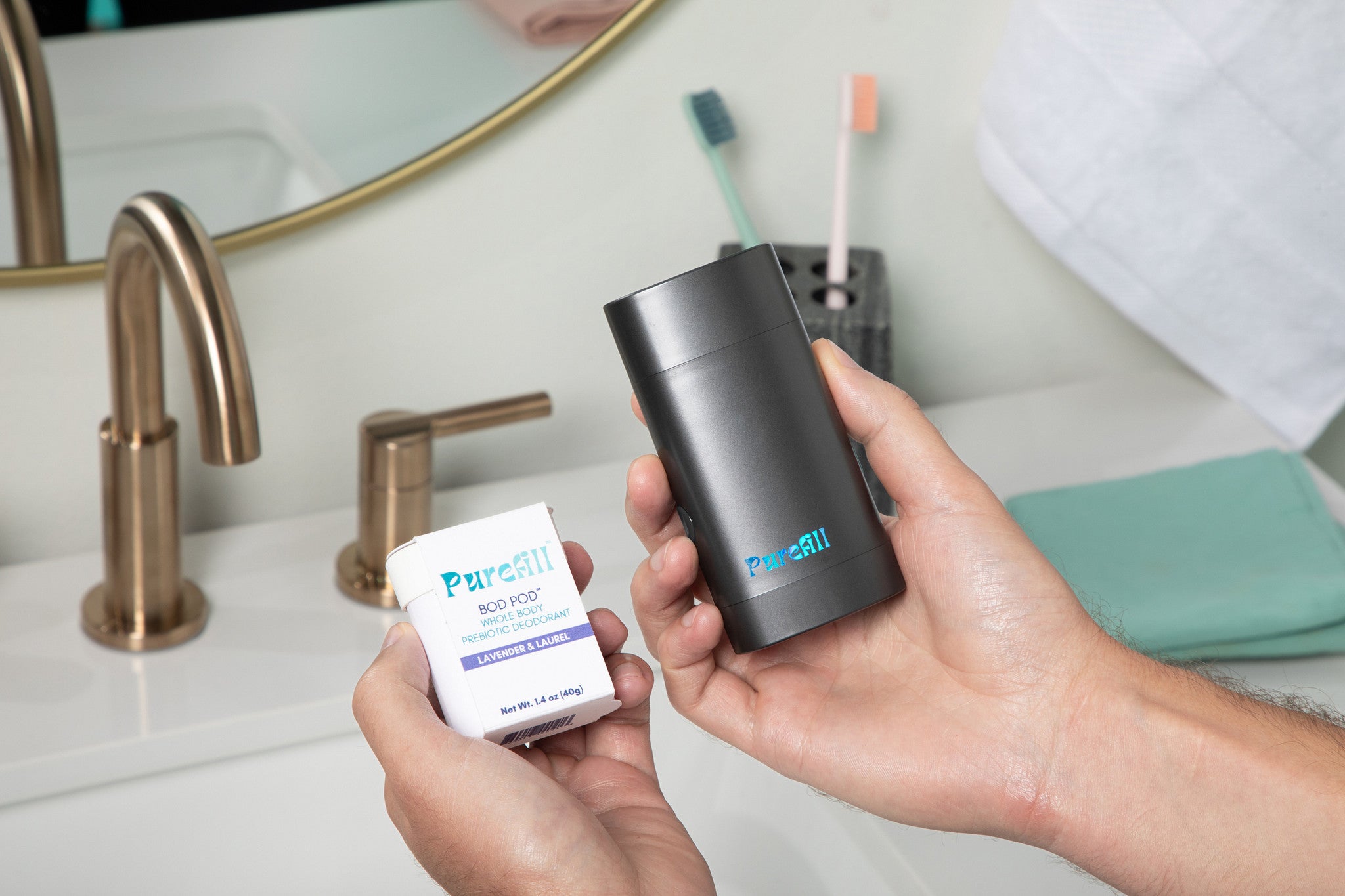 Hands Holding Bod Pod and Black Opal Refillable Case
