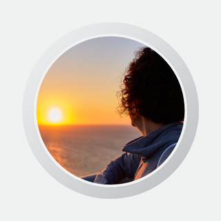 Profile image of a woman at sunset