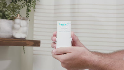 A person refilling a Purefill deodorant case